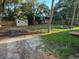 Large backyard with shed and a wooden privacy fence at 225 W 2Nd St, Chuluota, FL 32766