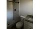 Updated bathroom with tiled shower, rainfall shower head, granite countertop, and modern fixtures at 225 W 2Nd St, Chuluota, FL 32766