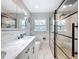 Bathroom with double vanity, marble countertops, a sleek toilet, and glass shower at 2631 Mcdonald Ter, Mount Dora, FL 32757