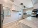 Modern kitchen featuring marble countertops, stainless steel appliances, and ample cabinet space at 2631 Mcdonald Ter, Mount Dora, FL 32757