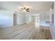 Bright and airy living room featuring hardwood floors, fresh paint, and abundant natural light at 2631 Mcdonald Ter, Mount Dora, FL 32757
