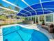 Inviting pool area with a covered bar and lounging space, perfect for outdoor relaxation and entertaining at 2631 Mcdonald Ter, Mount Dora, FL 32757