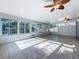 Bright sunroom with tile floors and large windows, offering ample natural light at 2631 Mcdonald Ter, Mount Dora, FL 32757
