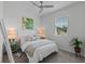 Cozy bedroom with a queen bed, plush pillows, soft blankets, and ample natural light at 2681 Spider Lily Ct, Clermont, FL 34711