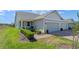 Beautiful home with a two-car garage and a well-manicured front yard at 2681 Spider Lily Ct, Clermont, FL 34711