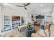 Bright living room open to the kitchen and dining area, perfect for entertaining at 2681 Spider Lily Ct, Clermont, FL 34711