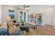 Inviting living room with a ceiling fan, and a sliding glass door with backyard view at 2681 Spider Lily Ct, Clermont, FL 34711
