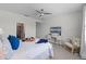 Cozy main bedroom with elegant décor, a sitting area, and a television for entertainment at 2681 Spider Lily Ct, Clermont, FL 34711