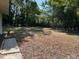 Large, partially shaded backyard offering plenty of space for outdoor activities and potential landscaping at 2886 Carew Ave, Winter Park, FL 32789