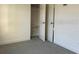 A carpeted bedroom offers ample space and an open closet at 2886 Carew Ave, Winter Park, FL 32789