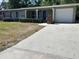 Charming single-story home featuring a well-maintained lawn, covered porch and a convenient attached garage at 2886 Carew Ave, Winter Park, FL 32789