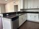 Beautiful kitchen with granite counters, stainless appliances, white cabinets, and a modern dishwasher for convenience at 2886 Carew Ave, Winter Park, FL 32789