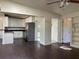 Open-concept living area with stylish kitchen, built-in shelves, and ample natural light creating an inviting atmosphere at 2886 Carew Ave, Winter Park, FL 32789