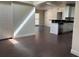 Open-concept living room featuring modern lighting and beautiful dark wood floors at 2886 Carew Ave, Winter Park, FL 32789