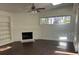 Cozy living room featuring a brick fireplace, built-in bookshelves, and large windows for ample natural lighting at 2886 Carew Ave, Winter Park, FL 32789