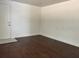 Room featuring wood floors and a doorway, offering an adaptable living space at 2886 Carew Ave, Winter Park, FL 32789