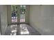 Bright sun room with tiled floors and glass french doors to enjoy natural light and backyard views at 2886 Carew Ave, Winter Park, FL 32789
