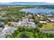 Aerial view showcasing the homes, ponds, and a lake nearby at 2956 Oak Park Way # B, Orlando, FL 32822