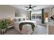 Bright primary bedroom with a large window, neutral decor, and a ceiling fan at 2956 Oak Park Way # B, Orlando, FL 32822