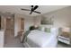 Bright primary bedroom with a large window, neutral decor, and ceiling fan at 2956 Oak Park Way # B, Orlando, FL 32822