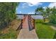 Picturesque dock and serene water view surrounded by lush greenery at 2956 Oak Park Way # B, Orlando, FL 32822
