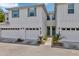 Townhomes featuring attached garages, quaint entryways, and lovely light fixtures at 2956 Oak Park Way # B, Orlando, FL 32822