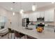 Modern kitchen featuring stainless steel appliances, a large island, and pendant lighting at 2956 Oak Park Way # B, Orlando, FL 32822