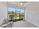 Screened lanai with view of the backyard, plants, and tiled floor at 2956 Oak Park Way # B, Orlando, FL 32822