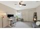 Home office equipped with adjustable desk, ceiling fan and natural light at 2956 Oak Park Way # B, Orlando, FL 32822