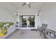Cozy covered patio with tiled floor, ceiling fan and sliding glass doors at 2956 Oak Park Way # B, Orlando, FL 32822