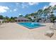 Large community pool with plenty of lounge chairs and a covered pavilion area at 2956 Oak Park Way # B, Orlando, FL 32822
