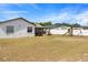 Expansive backyard featuring a lawn and play equipment, perfect for outdoor activities at 3041 Dikewood Ct, Winter Park, FL 32792