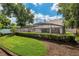 Screened-in pool and manicured lawn create a backyard oasis at 308 Pine Shadow Ln, Lake Mary, FL 32746