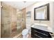 Modern bathroom features a vessel sink, large mirror, and walk-in shower at 308 Pine Shadow Ln, Lake Mary, FL 32746