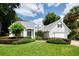 Beautifully landscaped, two-story home with a well-manicured lawn and lovely curb appeal at 308 Pine Shadow Ln, Lake Mary, FL 32746