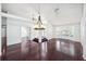 Spacious living room with beautiful hardwood floors and neutral walls, offering a clean and modern look at 308 Pine Shadow Ln, Lake Mary, FL 32746