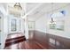 Bright living room with hardwood floors, a grand entrance door and ample natural light at 308 Pine Shadow Ln, Lake Mary, FL 32746