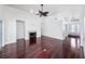 Open-concept living room featuring a fireplace, hardwood floors, and front entry access at 308 Pine Shadow Ln, Lake Mary, FL 32746