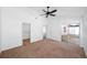 Bright main bedroom with ceiling fan, walk-in closet, and sliding door access to the patio at 308 Pine Shadow Ln, Lake Mary, FL 32746
