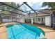 A screened-in pool and lanai offer private outdoor enjoyment at 308 Pine Shadow Ln, Lake Mary, FL 32746