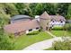 Aerial view of property featuring a private pool, lush landscaping, and distinctive Tudor-style architecture at 3420 Dawn Ct, Lake Mary, FL 32746