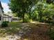 Large backyard surrounded by mature trees at 3420 Dawn Ct, Lake Mary, FL 32746