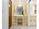 Bathroom vanity with detailed cabinetry and a large mirror, situated between the bathroom and the bedroom at 3420 Dawn Ct, Lake Mary, FL 32746