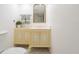 Well-lit bathroom with a unique vanity featuring a golden faucet and a stylishly tiled floor at 3420 Dawn Ct, Lake Mary, FL 32746