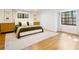 Bright bedroom featuring a comfortable bed, stylish decor, and an abundance of natural light from the windows at 3420 Dawn Ct, Lake Mary, FL 32746
