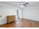 Bedroom featuring wood floors, white walls, and light neutral furniture at 3420 Dawn Ct, Lake Mary, FL 32746