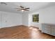 Bright bedroom with wood floors, ceiling fan, and natural light from window at 3420 Dawn Ct, Lake Mary, FL 32746