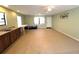 Spacious bonus room with countertop and sink, ready for customization and many different uses at 3420 Dawn Ct, Lake Mary, FL 32746