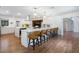 Open concept kitchen with white cabinets, quartz counters, and an island with seating for entertaining at 3420 Dawn Ct, Lake Mary, FL 32746