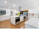 Modern kitchen featuring stainless steel appliances, a large island, and sleek countertops at 3420 Dawn Ct, Lake Mary, FL 32746